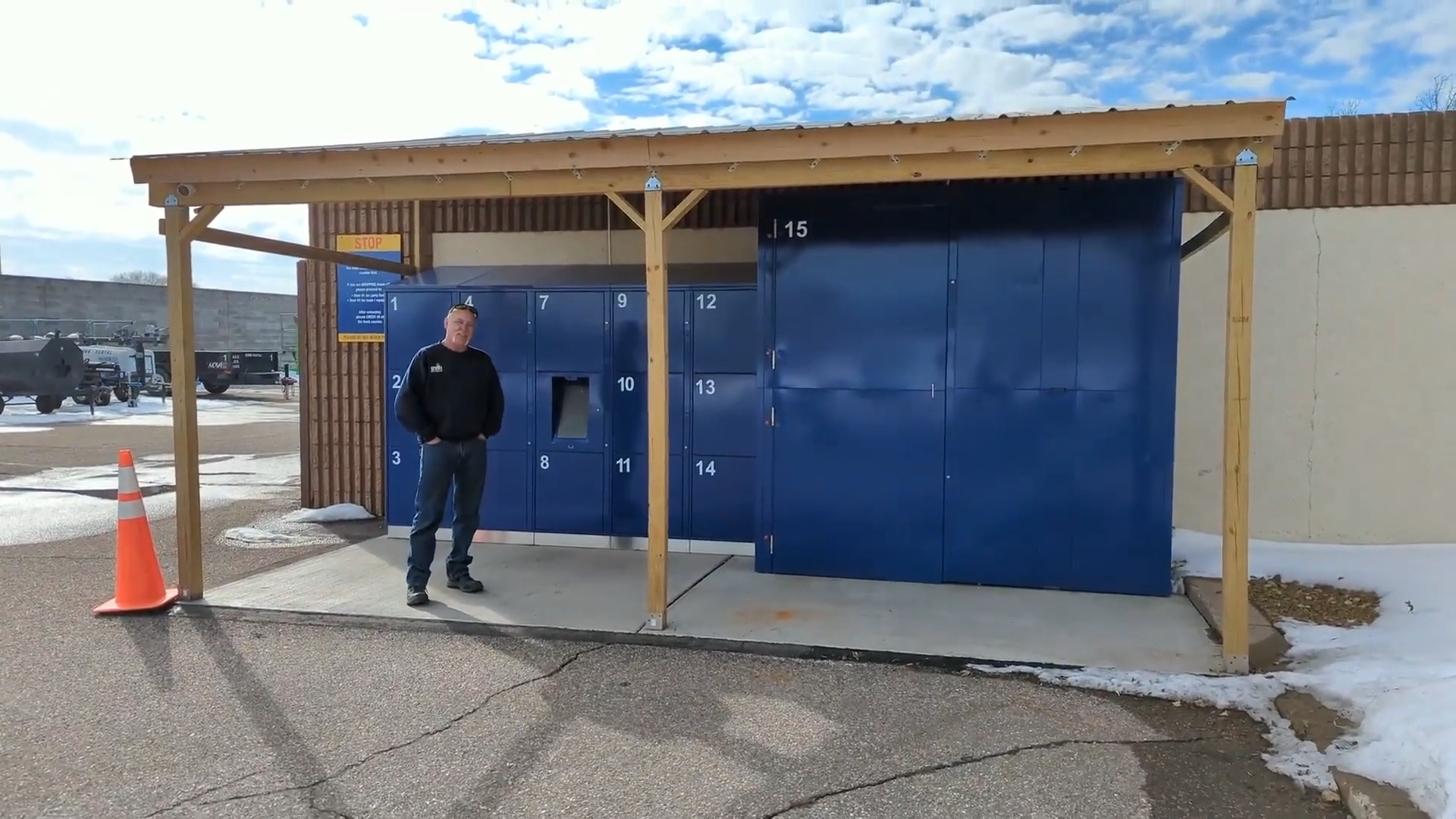 Doug Haas stands in front of the bank of rental lockers on his lot at Crown Rental.